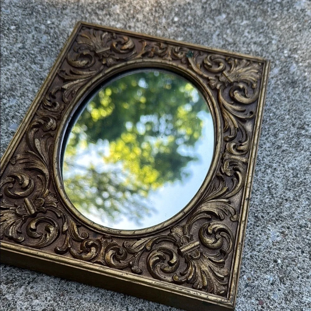Gold Ornate Mirror with Intricate Scrollwork